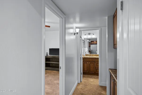 a dining hall with stainless steel appliances granite countertop a granite counter tops and a refrigerator