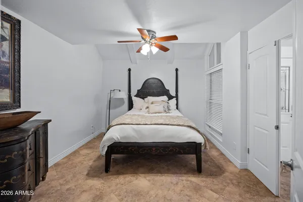 a view of a livingroom with workspace and a window