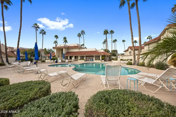 a view of a swimming pool with a patio