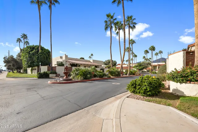 a view of a garden with a street