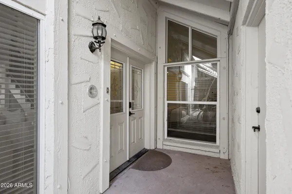 a view of a bathroom with a glass door shower