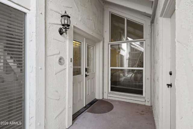 a view of a bathroom with a glass door shower