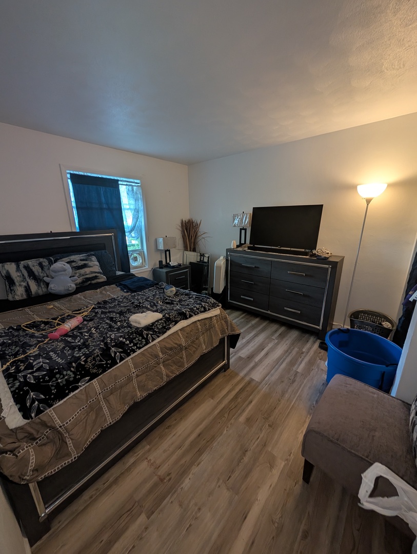 6232-6234 Appomattox Road Davenport, IA 52806 - Photo 19 of 21 a bedroom with a bed lamp and a fireplace