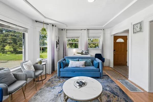 a living room with furniture and a large window