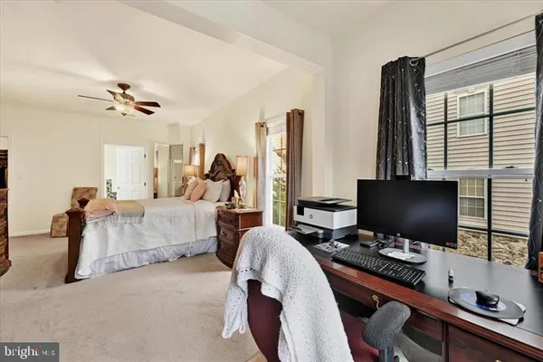 a bedroom with furniture and a window