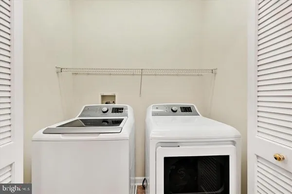 a view of a porch with wooden floor and fence