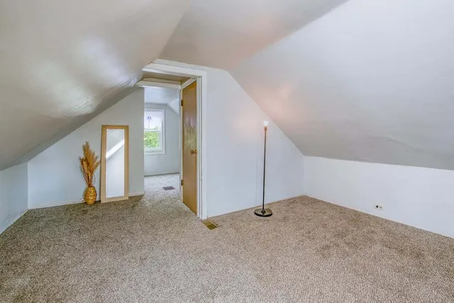 a view of a big room with closet and mirror
