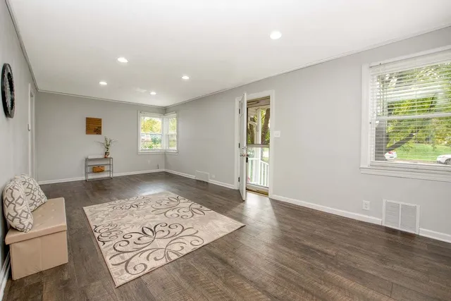 a living room with furniture and a rug