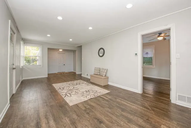 wooden floor in a hall with an entryway