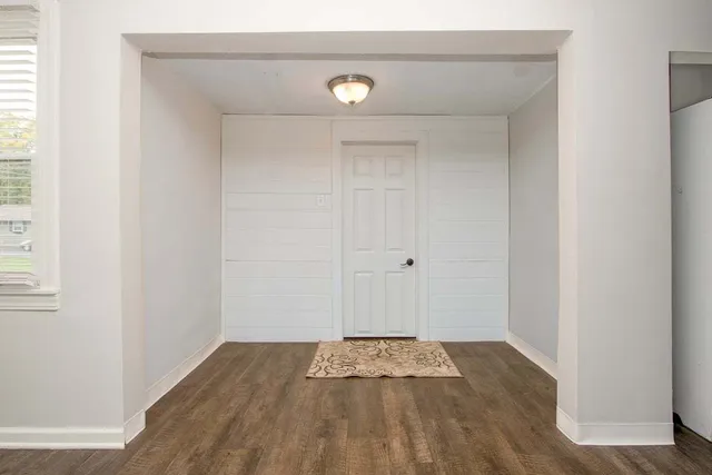 a view of a livingroom with wooden floor