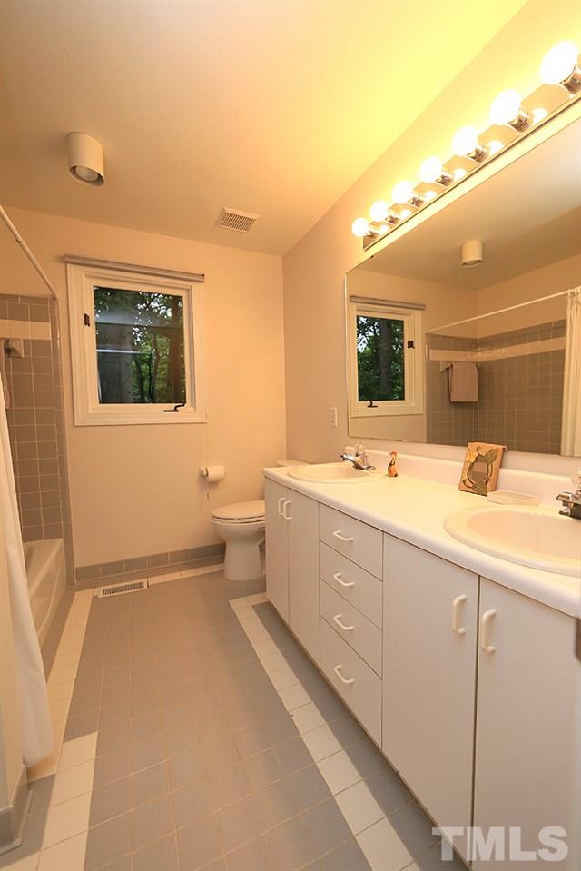 1504 Pecore Place Raleigh, NC 27615 - Photo 16 of 25 Full bath between bedroom 2 and 3.