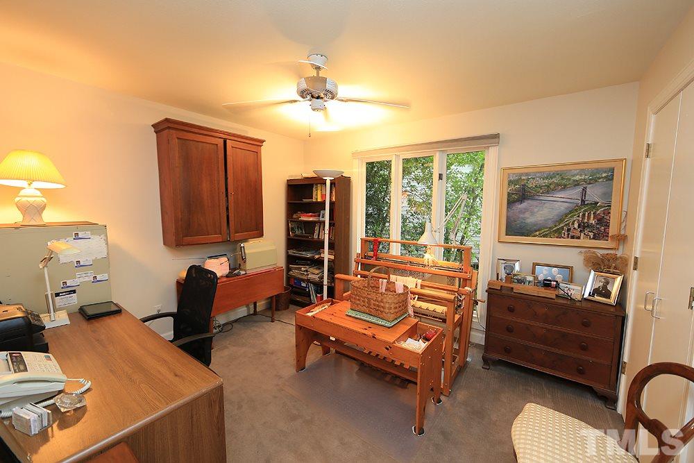 1504 Pecore Place Raleigh, NC 27615 - Photo 20 of 25 Bedroom 3 being used as an office and sewing room.