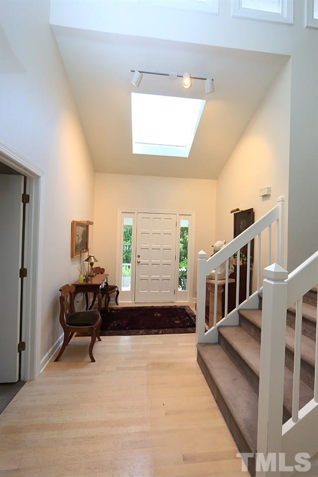 1504 Pecore Place Raleigh, NC 27615 - Photo 3 of 25 A beautiful 1st impression for your guests as they step inside to look straight out back at all the green trees.