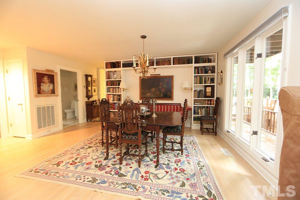 1504 Pecore Place Raleigh, NC 27615 - Photo 7 of 25 Enjoy a special meal with family or guests in the dining room that is open to the living room.