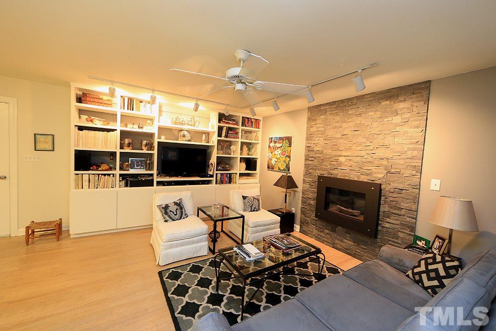 1504 Pecore Place Raleigh, NC 27615 - Photo 9 of 25 Upgraded 2013 with new bookshelves, cabinets, & glass doors. A very cozy spot to gather.