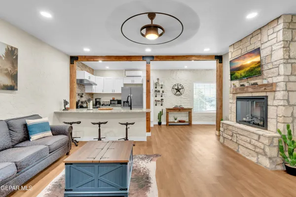 a living room with furniture and a fireplace