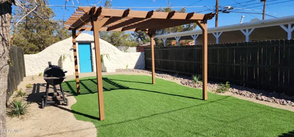 a view of a dinning room with furniture and floor to ceiling window