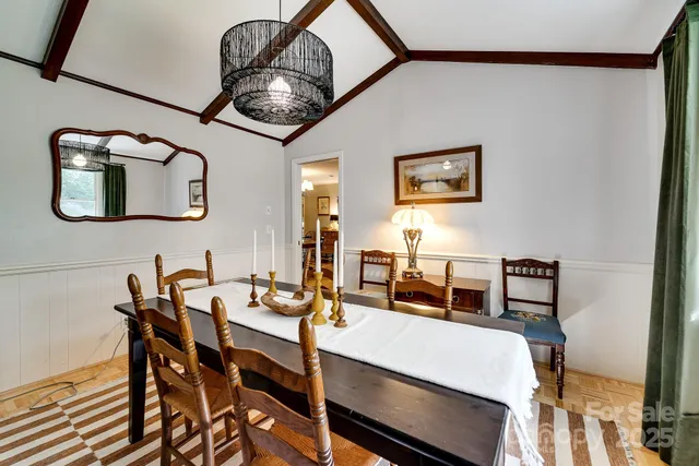 a dining room with furniture and window