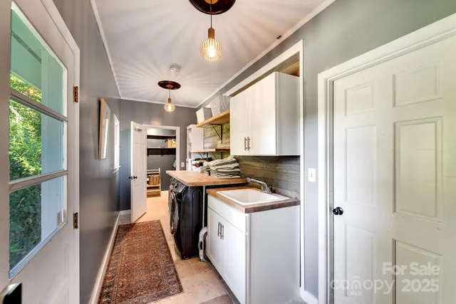 a kitchen view with stainless steel appliances granite countertop a stove and a refrigerator