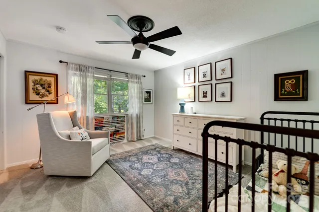 a living room with a couch and a chandelier