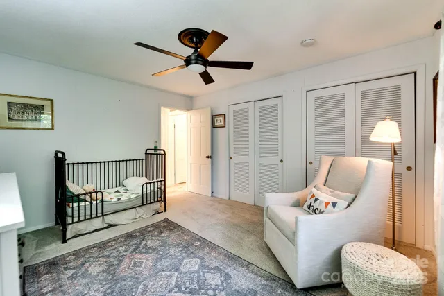 a bed room with bed and window