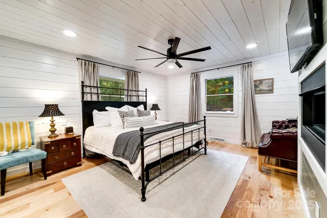 a bedroom with a bed window and couch