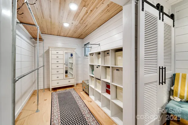 a view of a walk in closet and bedroom view