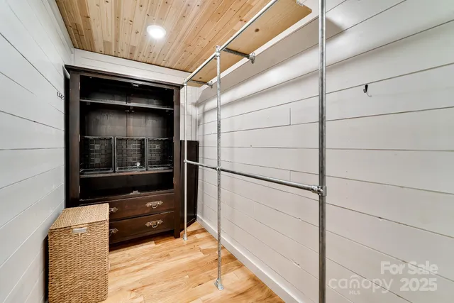 a bathroom with a tub sink a mirror and a shower