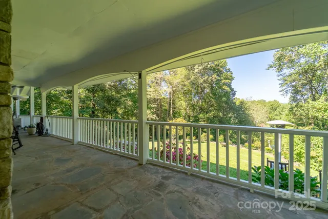a view of a house with a yard and garage