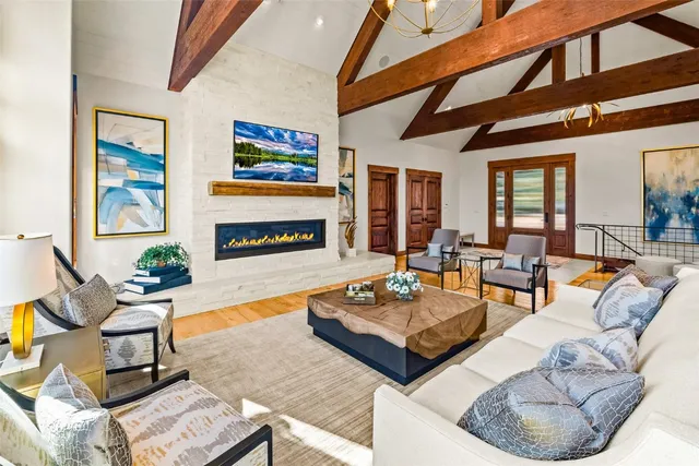 a living room with fireplace furniture and a flat screen tv