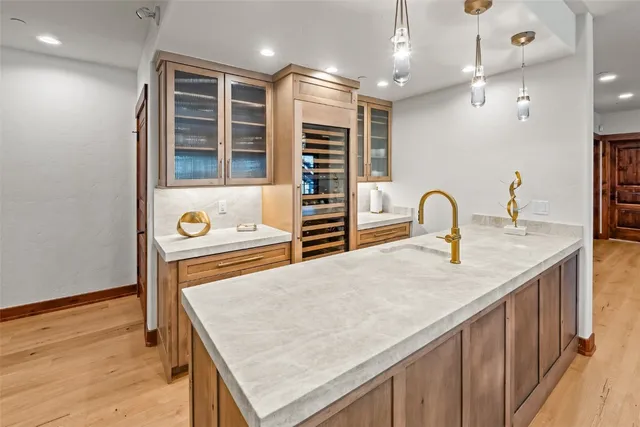 a kitchen with a stove a sink and a refrigerator