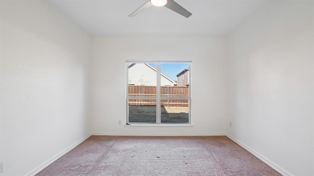 9904 Copperhead Lane McKinney, TX 75071 - Photo 19 of 40 Spare room with light carpet and ceiling fan