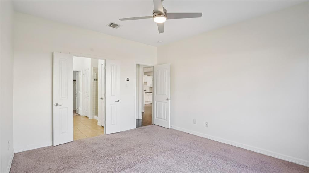 9904 Copperhead Lane McKinney, TX 75071 - Photo 20 of 40 Unfurnished bedroom featuring light carpet and a ceiling fan