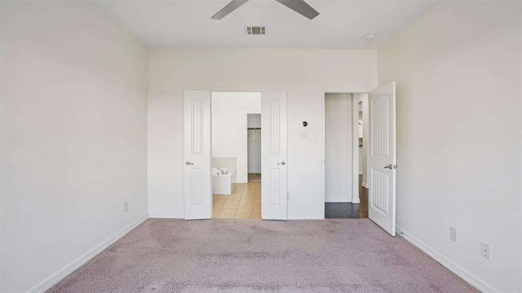 9904 Copperhead Lane McKinney, TX 75071 - Photo 21 of 40 Unfurnished bedroom with light carpet and a ceiling fan