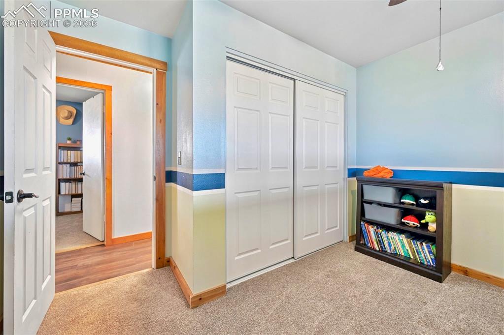 18560 Chelton Road Ramah, CO 80832 - Photo 17 of 34 a view of an empty room with shelves and a closet