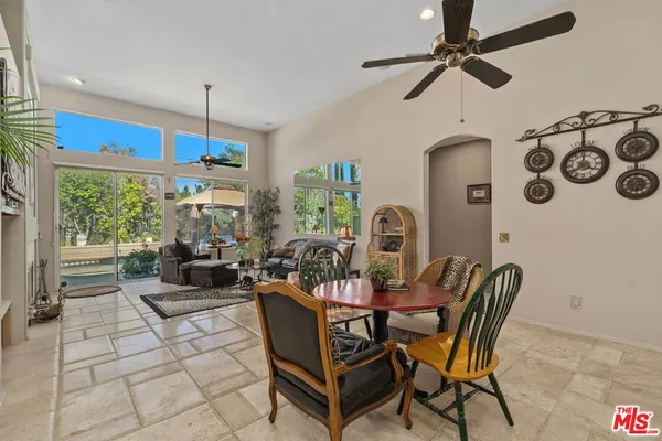 a view of a dining room with furniture window and outside view