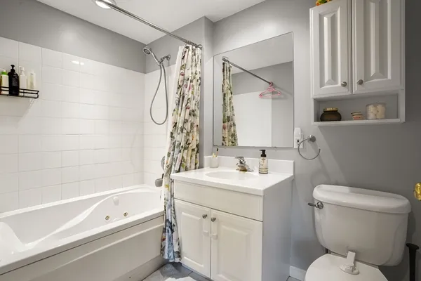 a bathroom with a sink a toilet and a bathtub