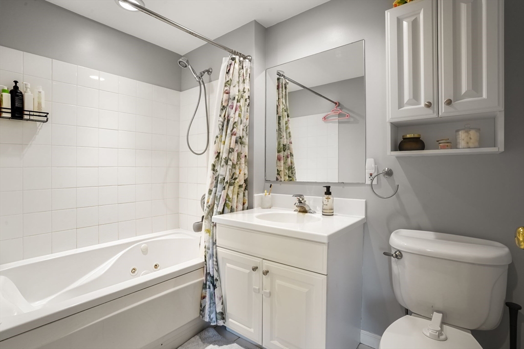 65 Chelsea Street, Unit 305 Boston, MA 02129 - Photo 19 of 30 a bathroom with a sink a toilet and a bathtub