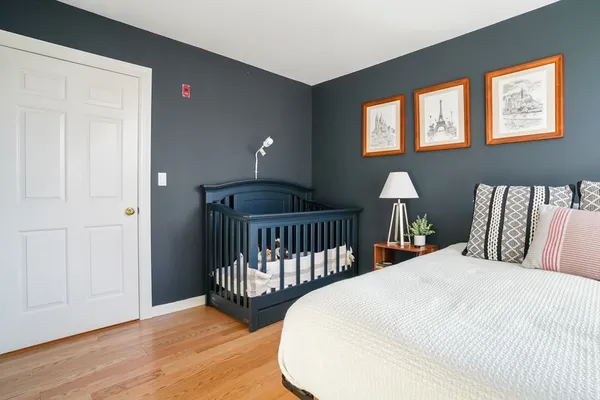 a bedroom with two beds and a window