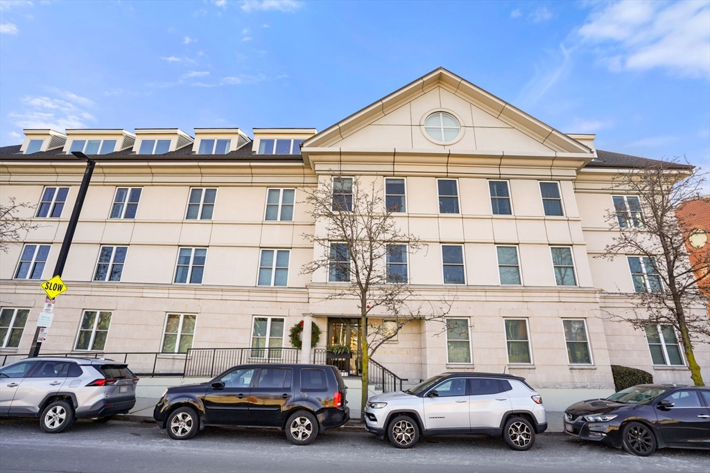 65 Chelsea Street, Unit 305 Boston, MA 02129 - Photo 23 of 30 a car parked in front of a house