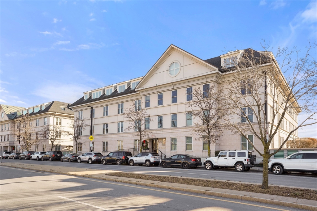 65 Chelsea Street, Unit 305 Boston, MA 02129 - Photo 25 of 30 a view of a white building among the street side