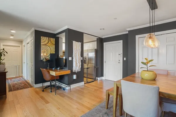 a dining room with a table and chairs