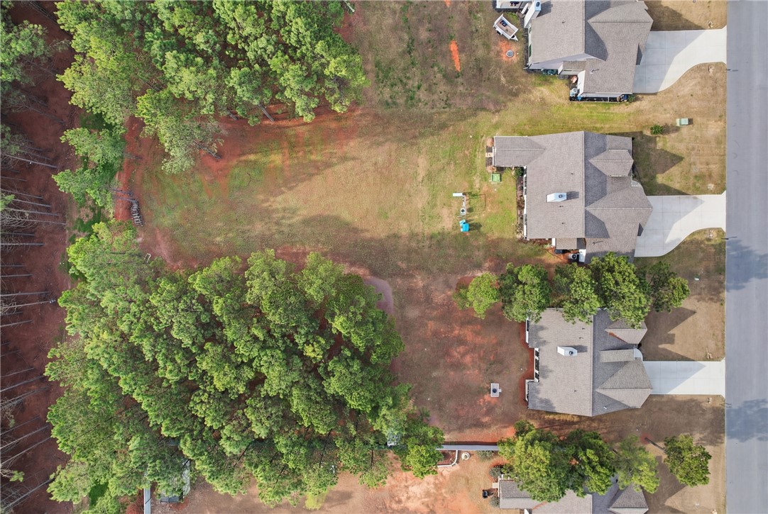 127 West Stewart Street Pelzer, SC 29669 - Photo 22 of 23 Aerial view of a verdant residential area featuring ample green spaces and well-maintained properties.