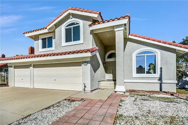a front view of a house with a garage