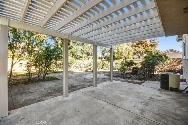 a view of a porch with wooden floor and roof