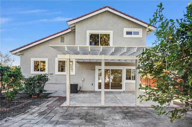 a view of a house with a yard and plants