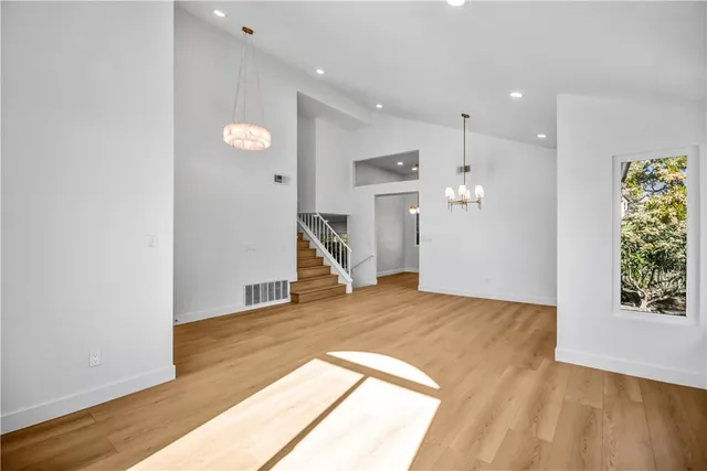 a view of a livingroom with a hall and window