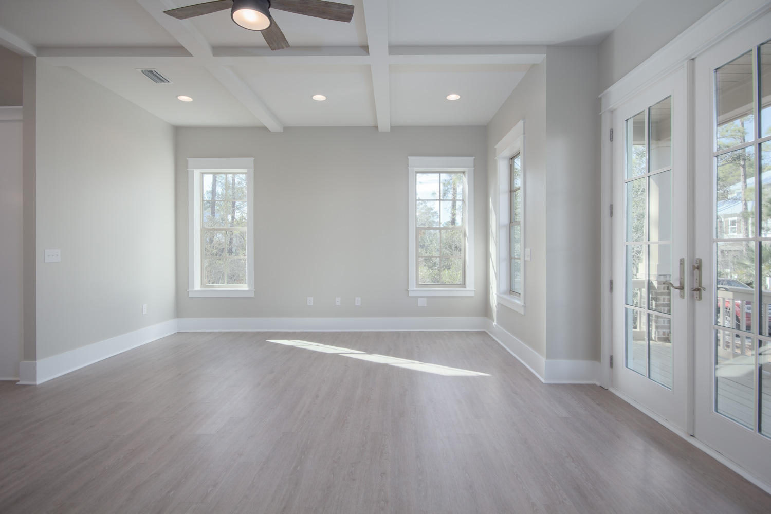 196 Matt's Way Santa Rosa Beach, FL 32459 - Photo 13 of 26 an empty room with wooden floor and windows