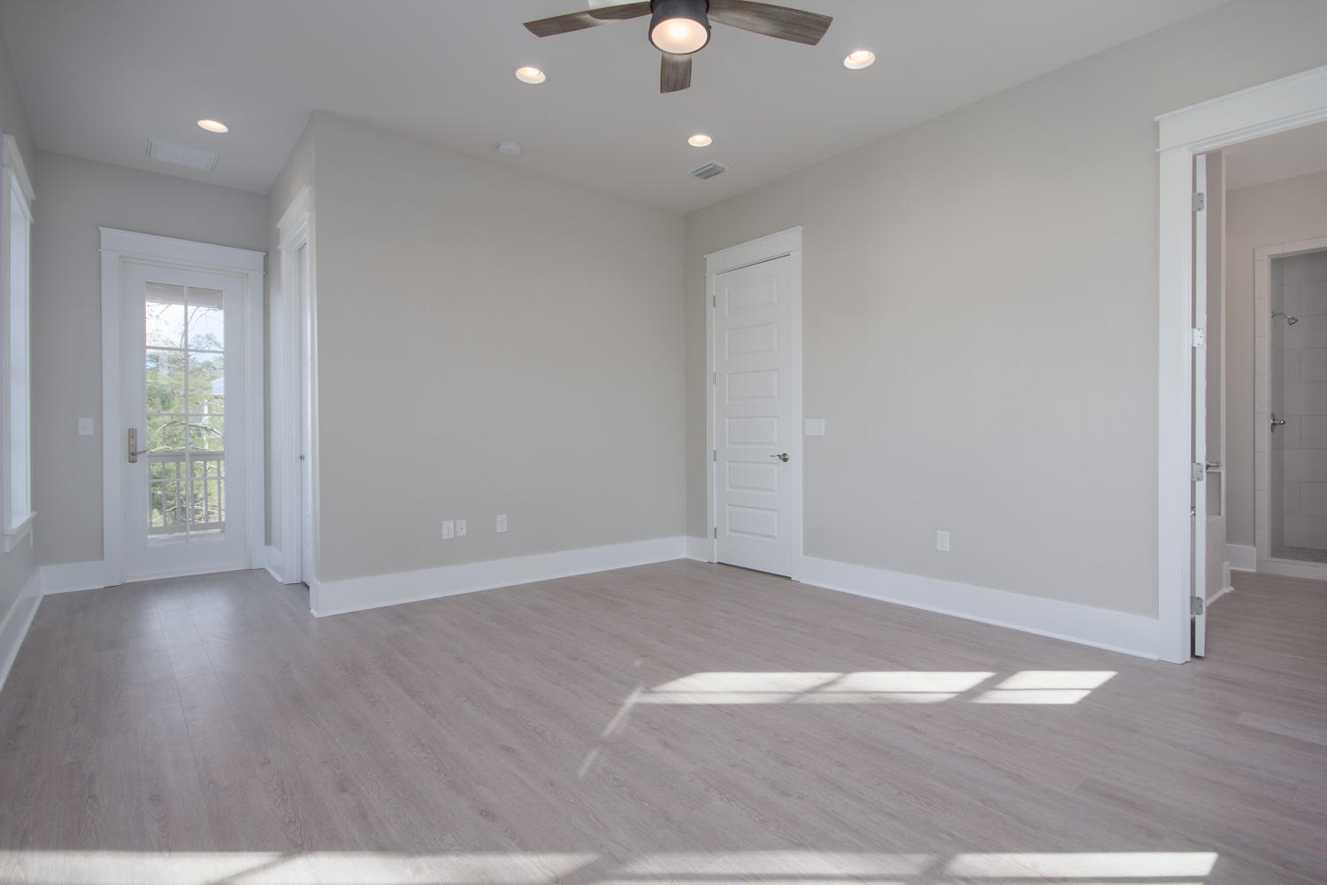 196 Matt's Way Santa Rosa Beach, FL 32459 - Photo 19 of 26 an empty room with wooden floor and windows