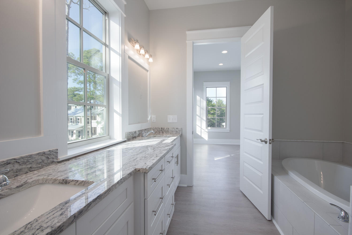 196 Matt's Way Santa Rosa Beach, FL 32459 - Photo 21 of 26 a bathroom with a granite countertop sink a bathtub and next to a window